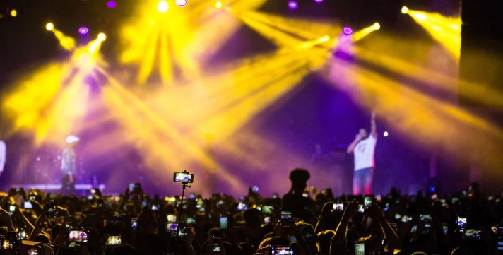Crowd at a live concert with stage lights
