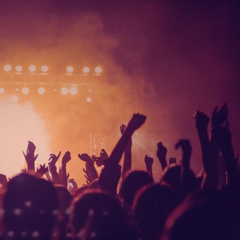 Concert stage crowd with festival lights